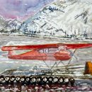 Hangar con aereo rosso e neve